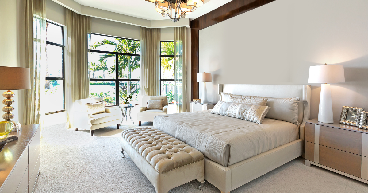 Contemporary master bedroom with navy and white two-color paint combination on accent wall