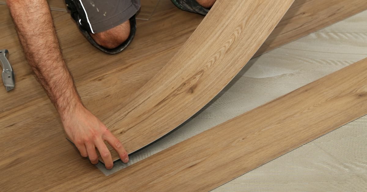 DIY peel and stick vinyl tile being installed step by step